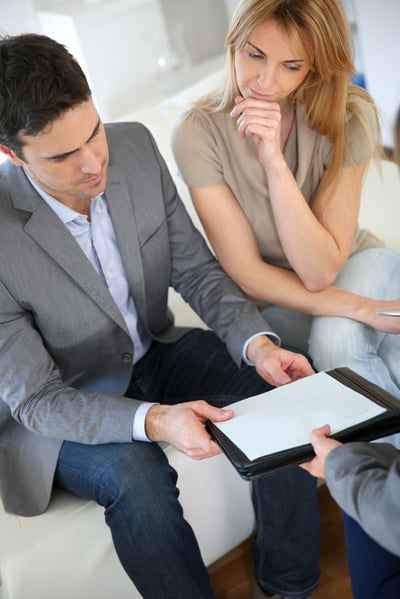 Couple meeting financial adviser for investment